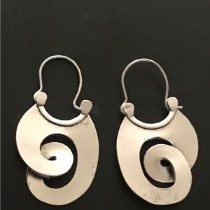 Silver tone swirl cut earrings. NWT